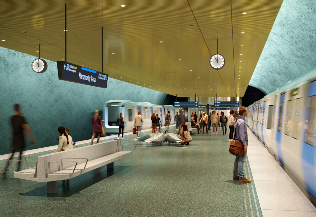 Visionsbild: Tunnelbaneperrong med människor som väntar och stiger av och på tågen, omgiven av en grönaktig vägg och tak i guldton. En skylt visar Hammarby kanal, och klockor hänger från taket.