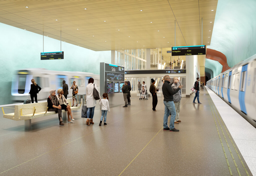 En grupp människor står på en plattform och väntar på tunnelbanetågen som kommer in. 