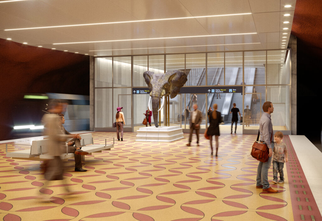Människor står på en plattform och väntar på tunnelbanan.